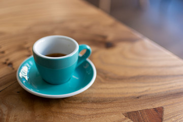 Coffee cup close up morning cafe view. Coffee concept. Wooden texture background. Wood material. Roasted Italian espresso. Place for text. Natural vintage shop with coffee and cappuccino