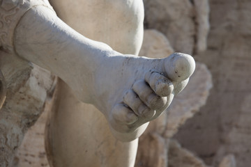 Part of leg of ancient marble statue in Rome, Italy