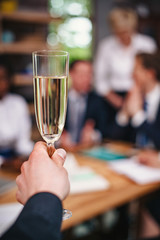 Office workers celebrate the end of successful negotiations