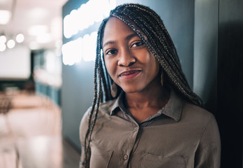 Portrait of a beautiful young black african student with long braided hair