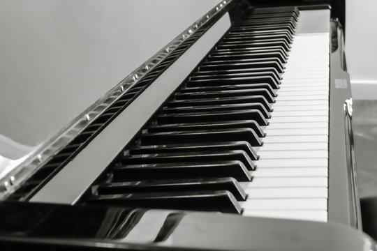 shot of a piano keyboard in black and white
