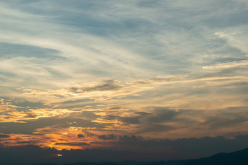 Fototapeta na wymiar sunlight through cloud on dramatic sunset sky