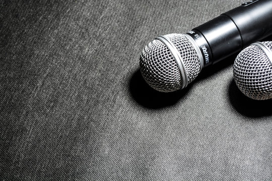 Kiev, Ukraine. January 10, 2019. The microphone for singing on black background lies. Karaoke. Modern technologies. Music. Gadgets