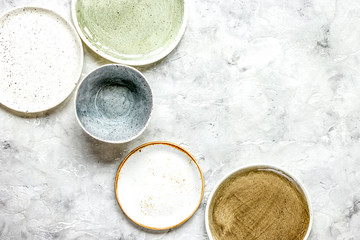 ceramic tableware top view on stone background mock up