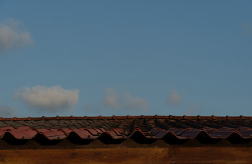 Old roof red color on house under the evening light.
