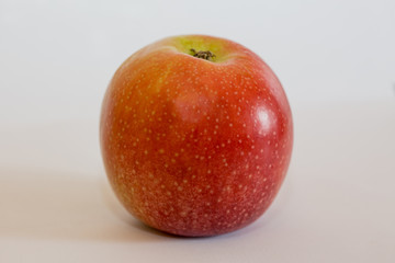 Isolated apple fruit on white background side view