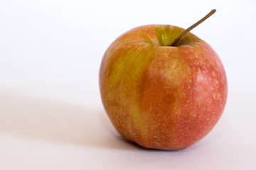 Isolated apple fruit on white background side view