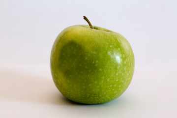 Isolated apple fruit on white background side view