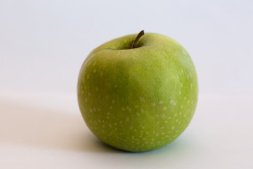 Isolated apple fruit on white background side view