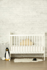 White wooden crib in a baby room