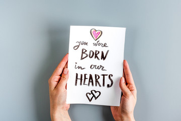 family concept with card on desk top view mock up