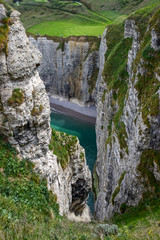 Scenic alabaster chalk cliffs of Etretat and coast of Atlantic ocean, travel and vacation destination in Normandy, France