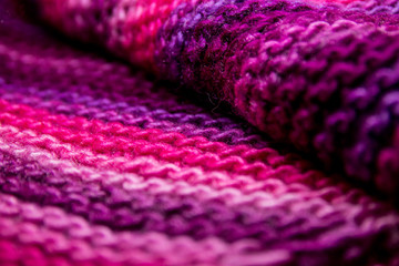 Pink, white and violet striped knitted texture background