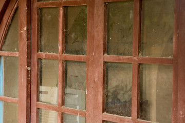 Old dirty window with dusty glass in old house