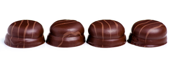 Chocolates with souffle on a white background. Isolation