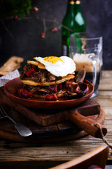 Irish potato pancakes with sausage beer stew.selective focus