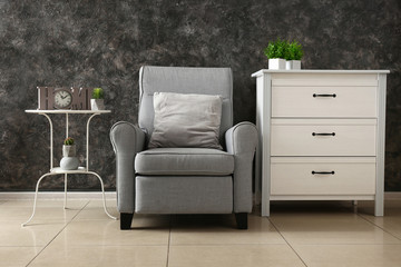 Stylish interior with cozy armchair