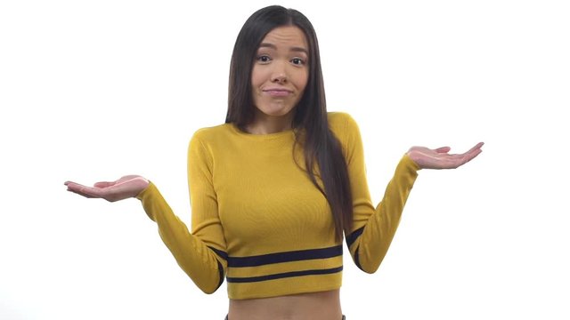 Slowmo lovely cute east-asian female office assistant smirking sorry look, shrugging unaware, raising hands clueless, having no idea, cannot answer, apologizing not knowing info, white background