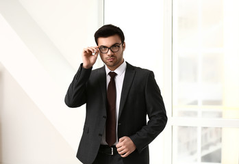 Portrait of handsome young businessman in office