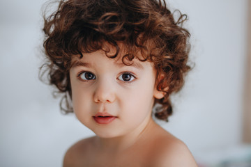 Portrait of a young boy with curly hair