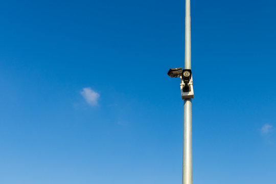 Surveillance camera in brick wall