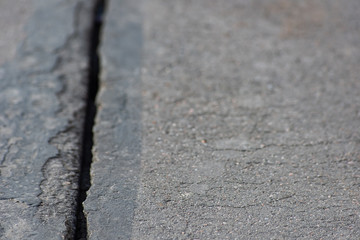 Big crack on asphalt canvas