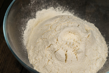 Fototapeta na wymiar Flour in a bowl close-up