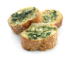 Tasty cut garlic bread on white background