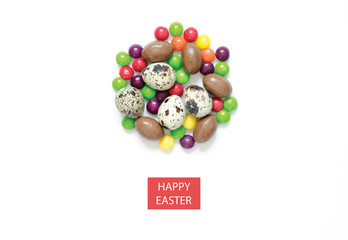 Inscription Happy Easter. Easter eggs, multicolored sweets. Flat lay, top view.