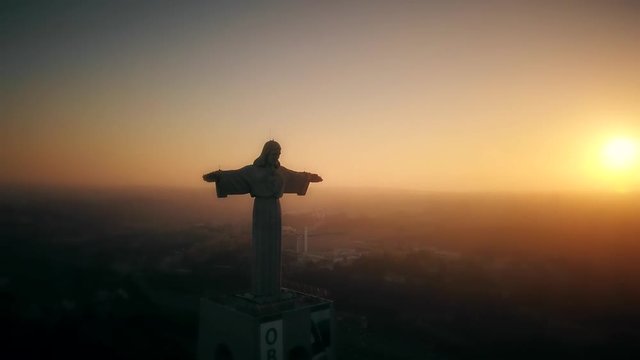 Aerial footage of Sanctuary of Christ the King in Lisbon, Catholic monument.