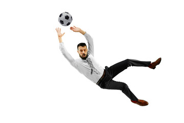 Fototapeta premium Full length shot of a young businessman playing football isolated on white background.