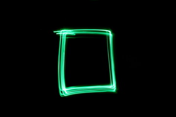 Long exposure, light painting photography.  Abstract box outline design, vibrant color against a...