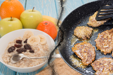 healthy and unhealthy Breakfast. Oatmeal with raisins in a white bowl. Fruits. Fried steaks
