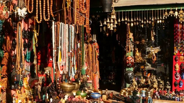 Traditional colorful Handmade wooden masks and handicrafts for sale in Kathmandu, Nepal. Souvenir Shops in Durbar of Bhaktapur and Patan. Swayambhunath decorative asian market.