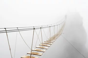 Fotobehang Hangbrug in mist © Svetlana Lukienko