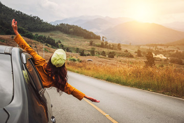 Asian women travel relax in the holiday. driving a car traveling happily.
