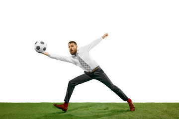 Full length shot of a young businessman playing football isolated on white background.