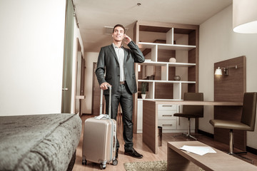 Fototapeta premium Businessman wearing suit and leather shoes standing in room