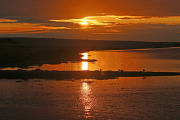 Naklejka premium Fleet Basin, Dorset at sunset