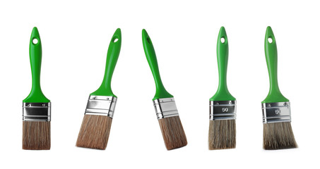 Set of clean paint brushes on white background