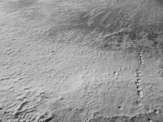 Snow on the ice of the river. Frozen river. Ice on the river.