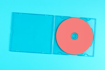 Pastel pink cd in case on pastel blue background. - 250479101