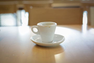 Obraz premium white coffee cup on wooden table