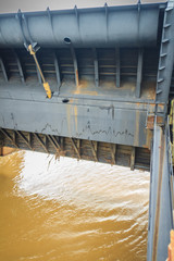 Hydraulic water gate is shifting up to allow water flow through in the rainy season. The Pak Mun Dam is run-of-the-river hydroelectric plant of the Mun river in Ubon Ratchathani Province, Thailand.