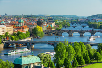 Scenic view on Vltava rive, Charles bridge and historical center of Prague, buildings and landmarks...