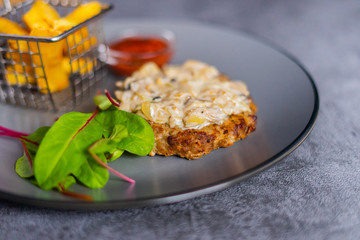 Steak with mushrooms on a gray background 