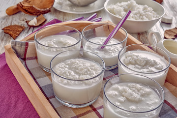 close-up of coconut cocktail in glass cups