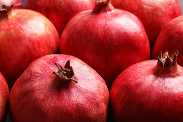 Many red ripe pomegranate fruits as background, closeup