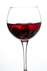Wine glass with red wine on white background