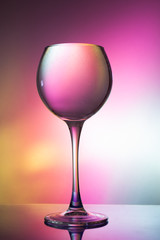Glass of water on a colored background